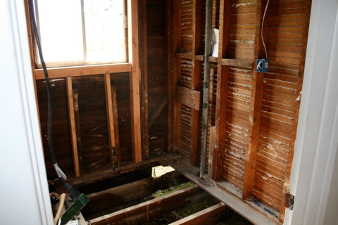 Gutted guest bathroom.  Note the rotted wood which was replaced.