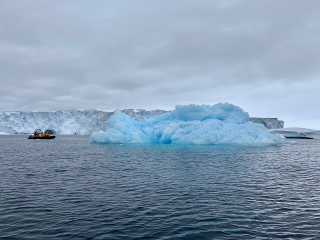 Same blue-ice iceberg with humans for size comparison