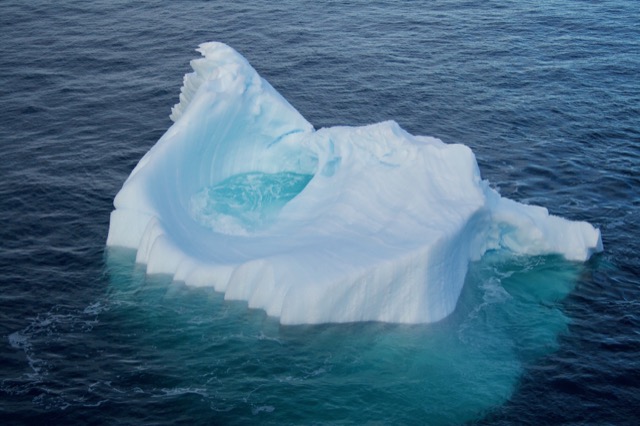 An iceberg with a puddle in the middle