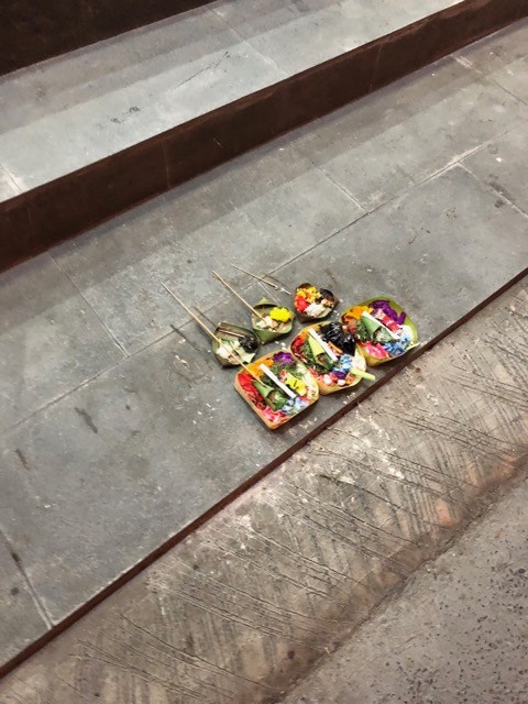 Canang sari, peace offering on the stoop of a store
