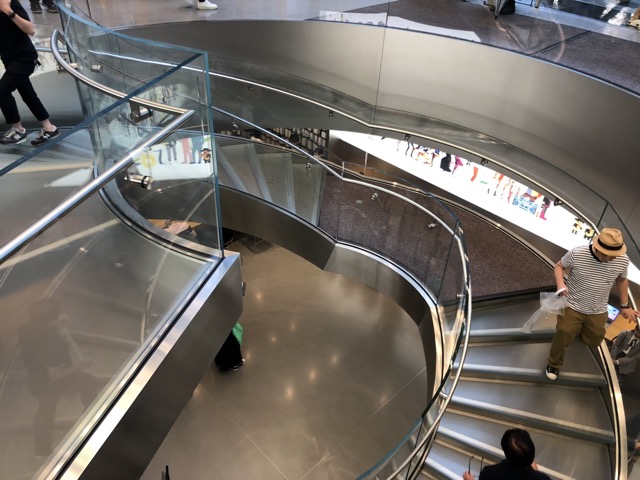 Looking down the glass staircase