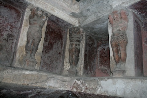 Statues in the wall of the warm room.  The cubbies were used to hold ointments and other trinkets