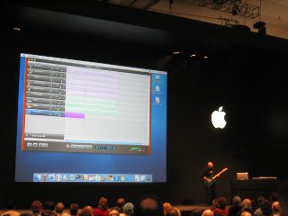 Martin playing the guitar on stage for GarageBand