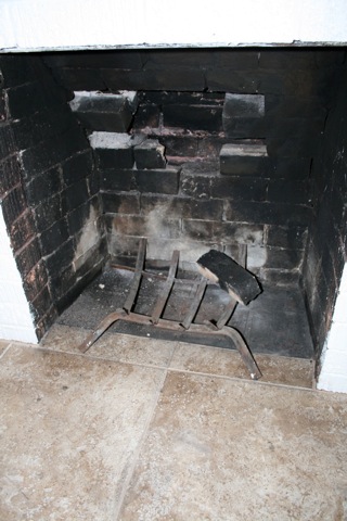 Inside fireplace...will need to be repaired