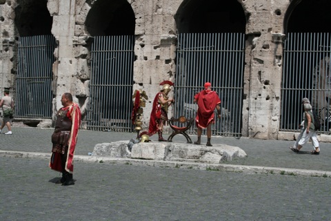 People dressed up as old romans who you can pay to take your picture with